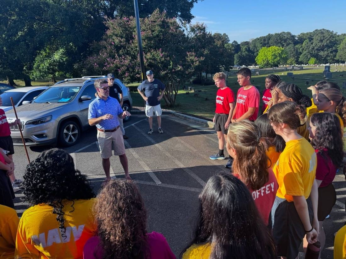 Post 144 leadership briefs South Point High School Naval JROTC cadets before a cleanup day at Greenwood Cemetery.